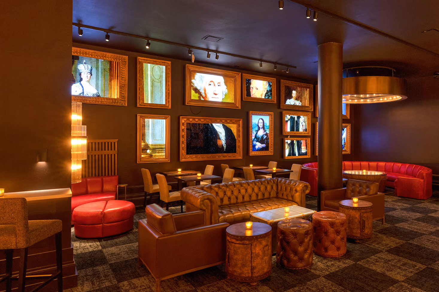 Warm lounge with leather sofas, armchairs, tables with candles, and framed classical paintings on the wall.