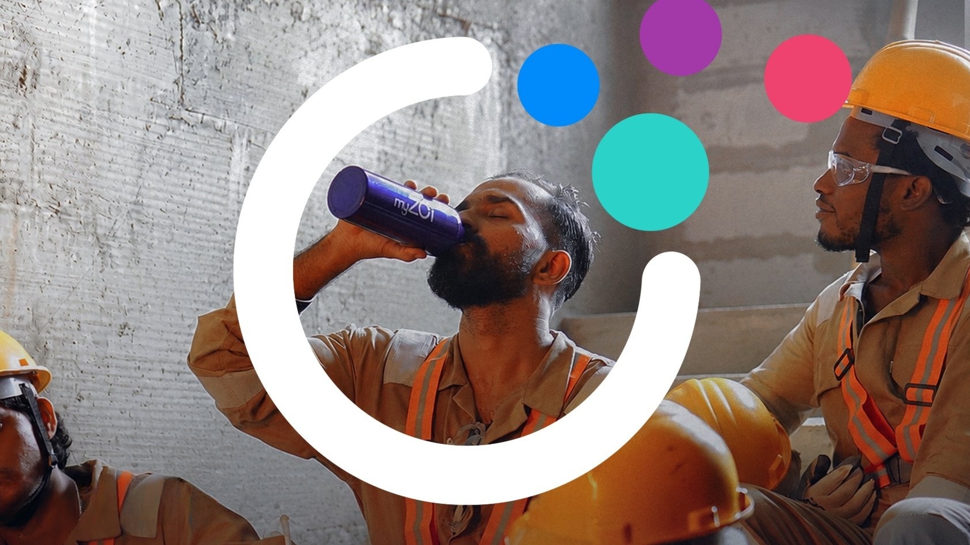 Construction worker drinking from a myZoi water bottle during a break