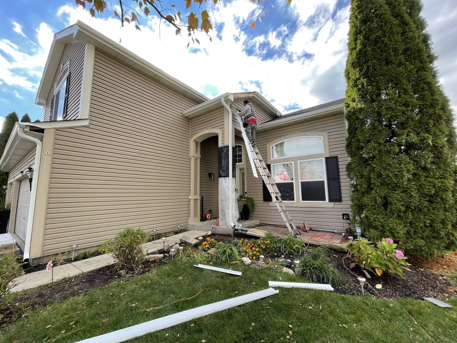 Aluminum fascia wrap capping installed over wood trim in Hoffman Estates, IL