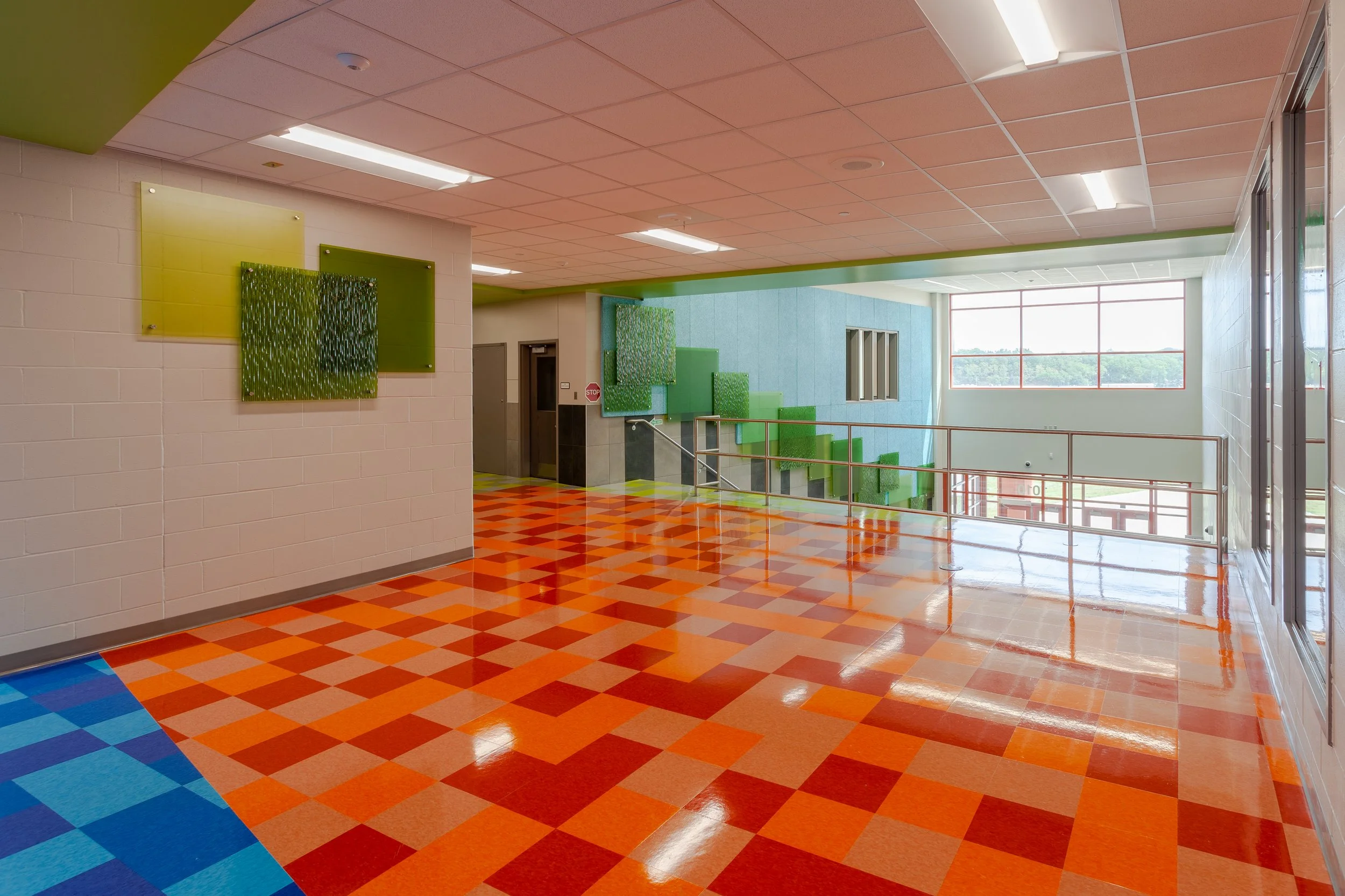 Commons with orange and red diamond floor pattern and clerestory windows