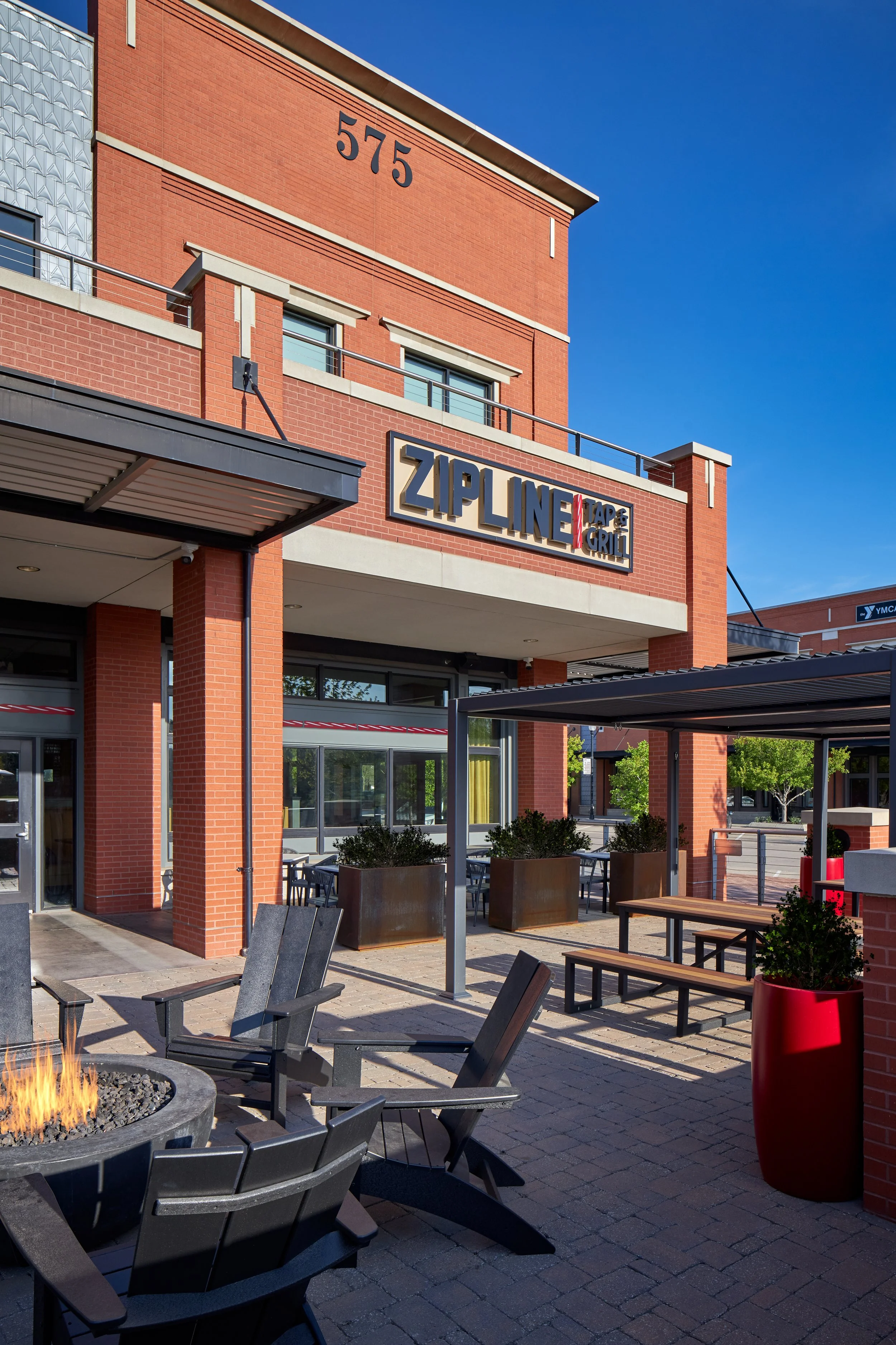 Exterior patio at Zipline Tap and Grill in Lincoln with fire pit seating