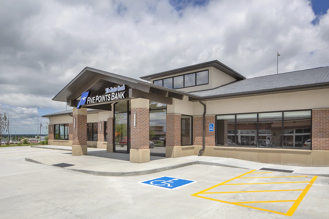 Exterior of the Five Points Bank branch with brick and a covered drive-through