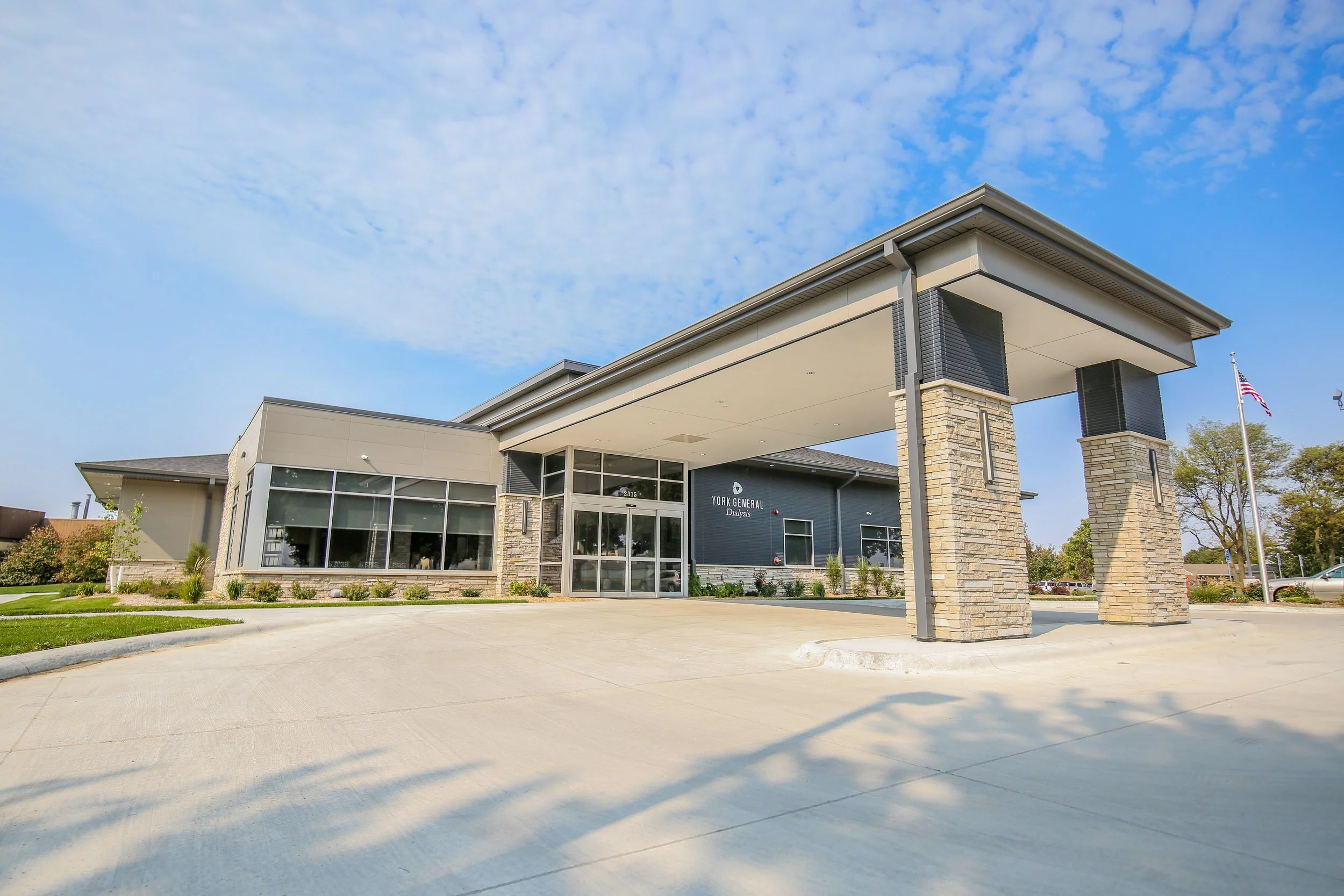Exterior of York General Dialysis Center in York, Nebraska with a covered stone entry