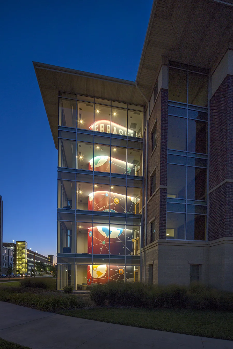 Eastside Suites entrance and lit stairwell at twilight