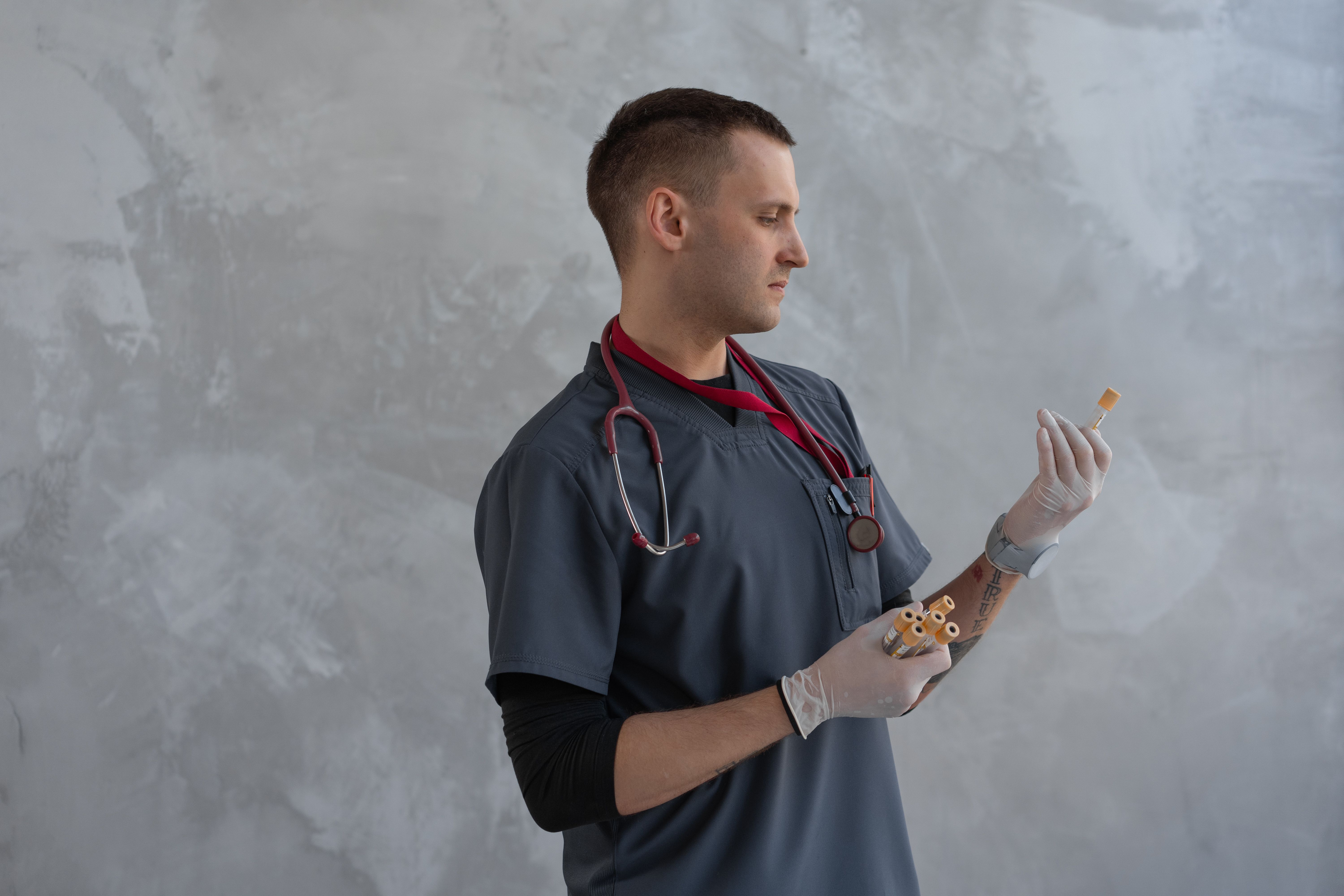 Laboratory professional handling blood samples in a modern clinical setting