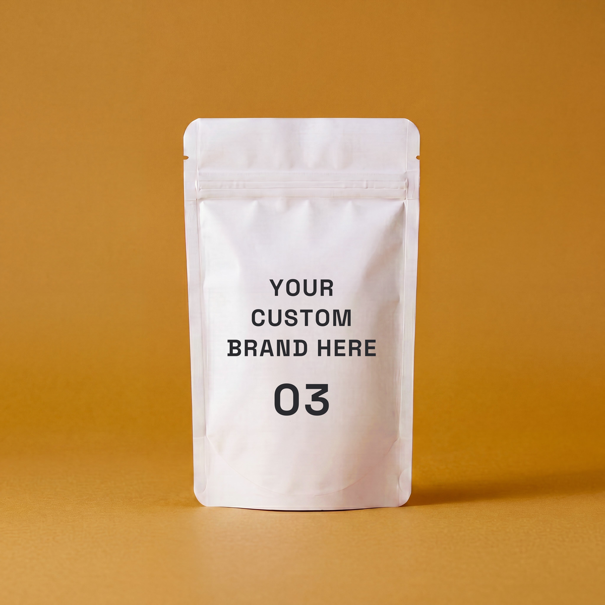 White stand-up pouch with zipper on a brown background, labeled Your Custom Brand Here 03.