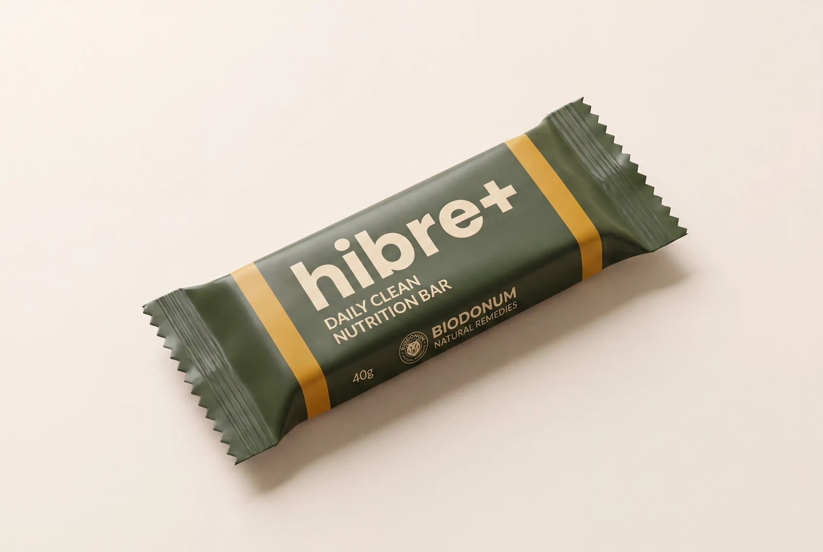 Green 40g hibra+ daily clean nutrition bar packaging with yellow stripes on light background.