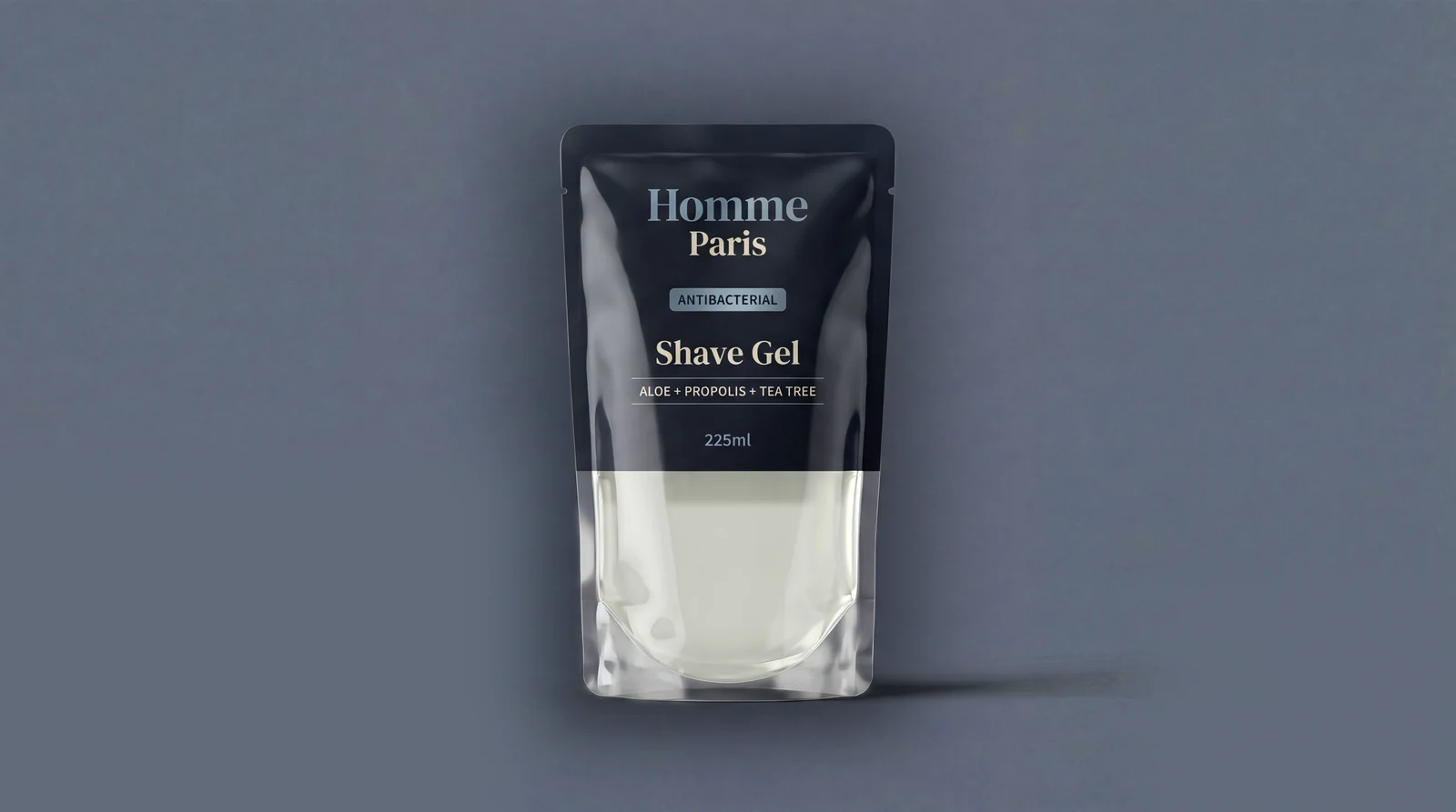 Black and translucent pouch of Homme Paris antibacterial shave gel with aloe, propolis, and tea tree, 225ml.