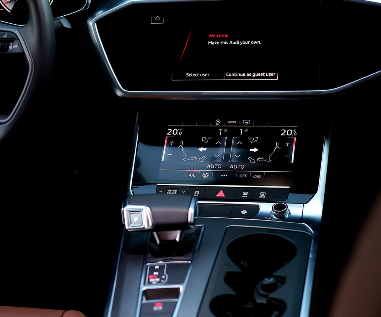 Audi car interior dashboard with digital screens and climate controls