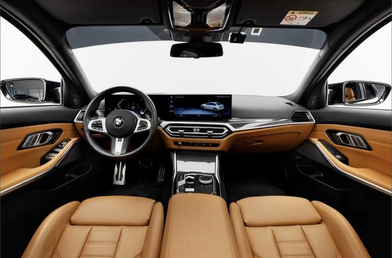 BMW interior with tan leather seats and modern digital dashboard