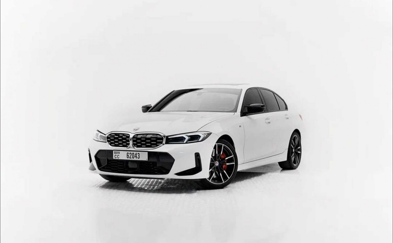 White BMW 3 Series sedan with sporty design and black accents