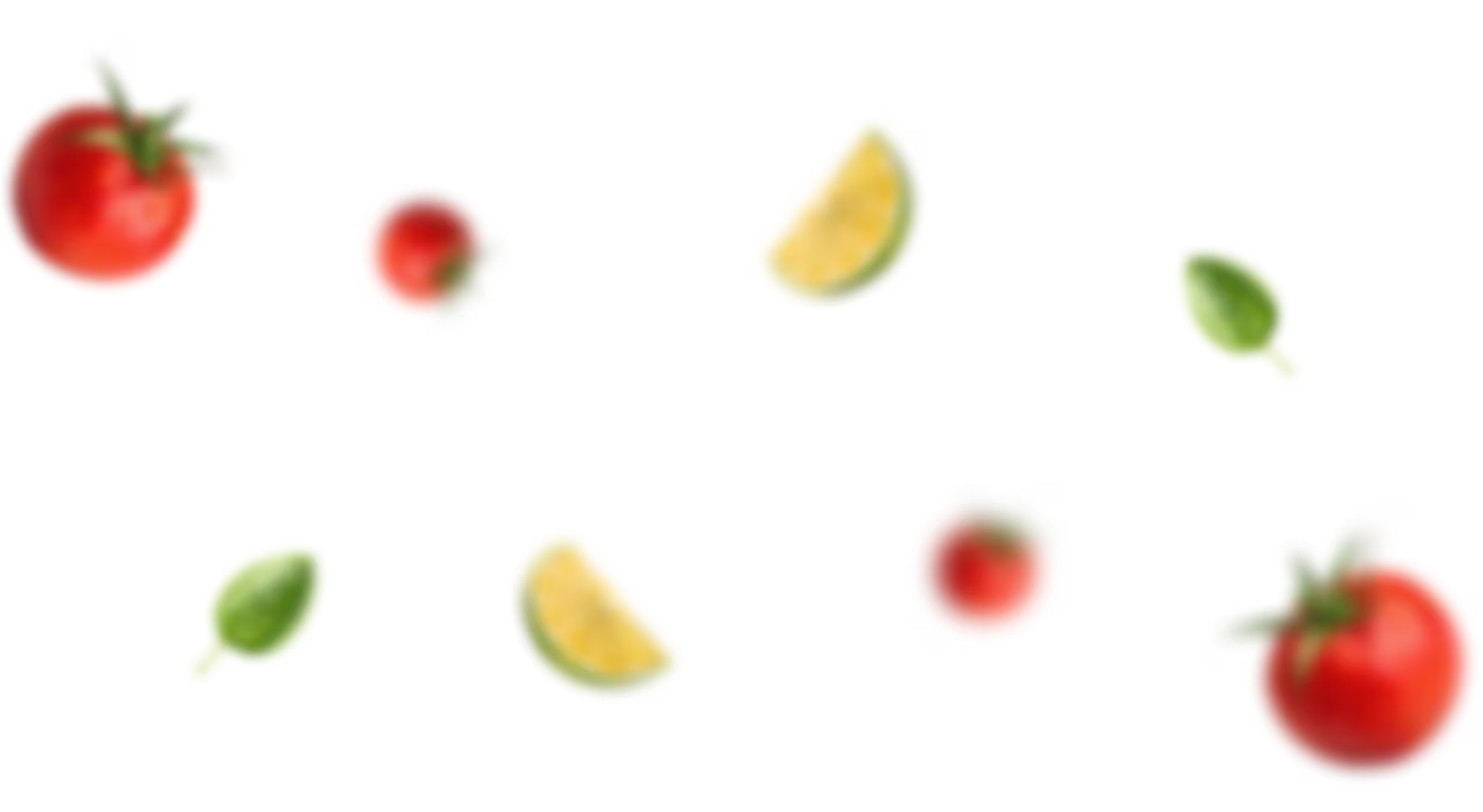 Scattered tomatoes, lime wedges, and basil leaves on a black background.