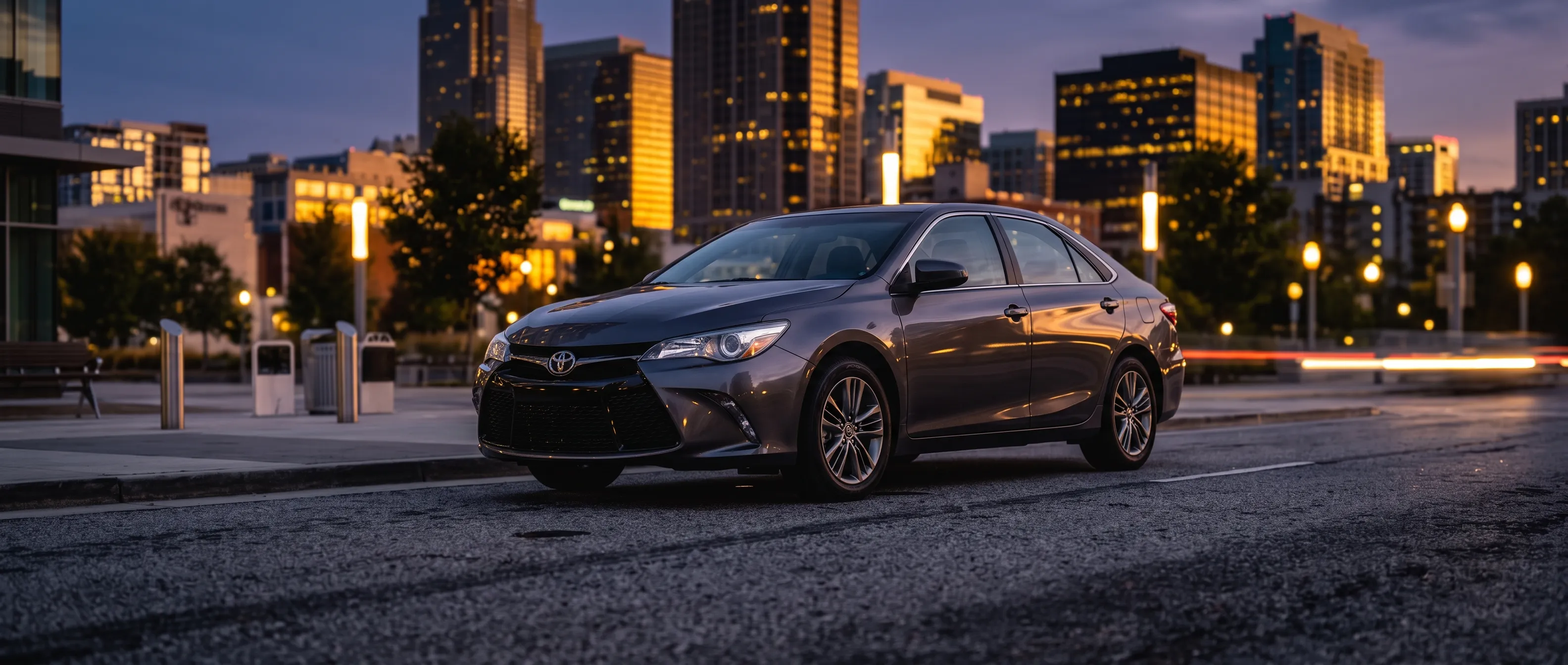 AI-generated illustrative photo of a grey Toyota Camry sedan, not an actual Rideshare Car Rentals vehicle
