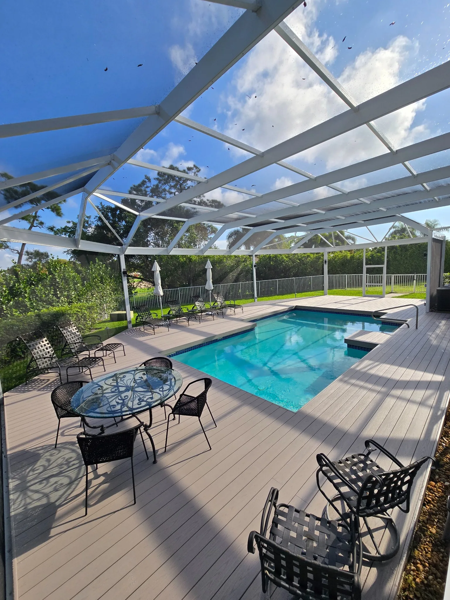 image of a landscaped pool area (for a landscaping service)