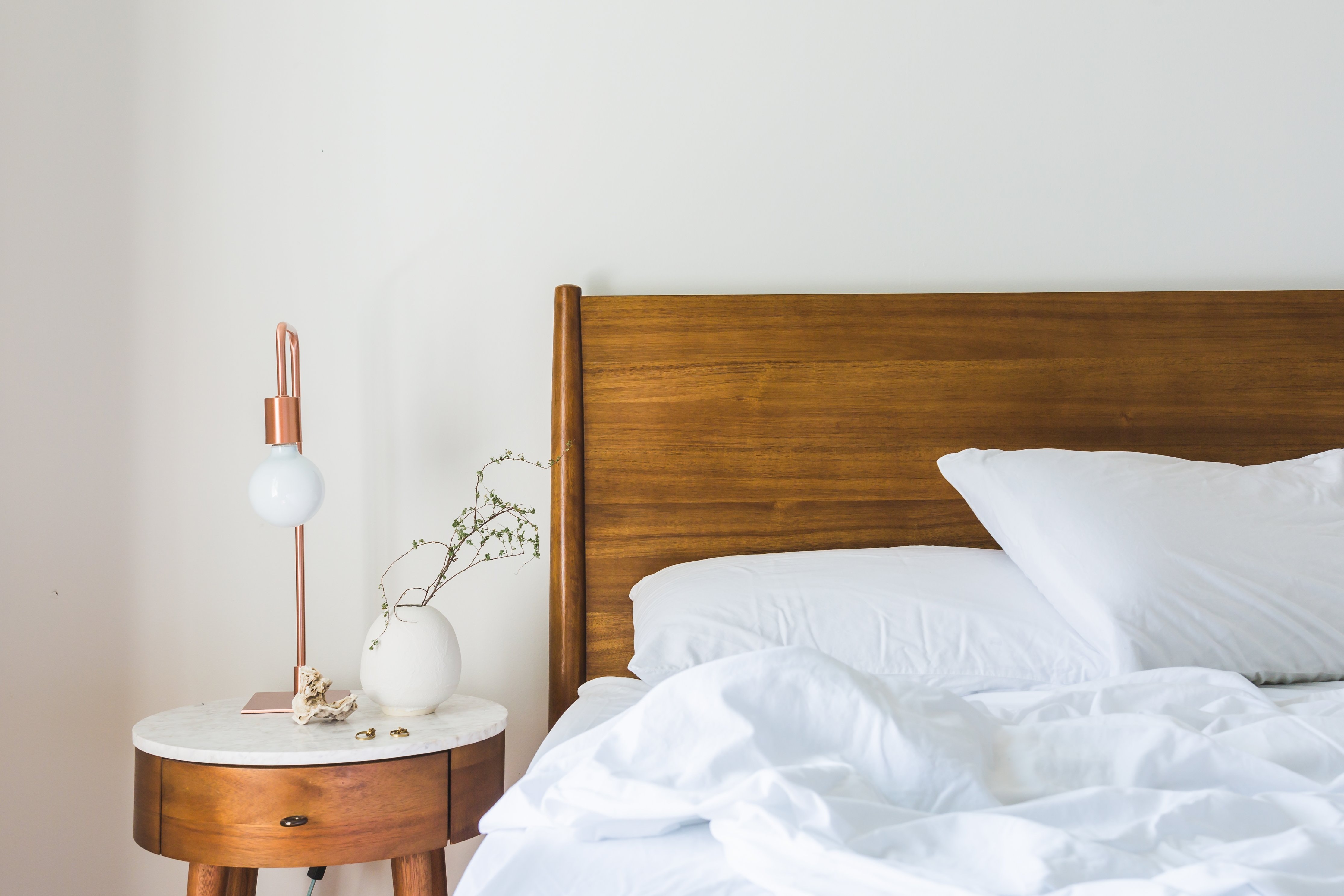 Bed with wood headboard stock image