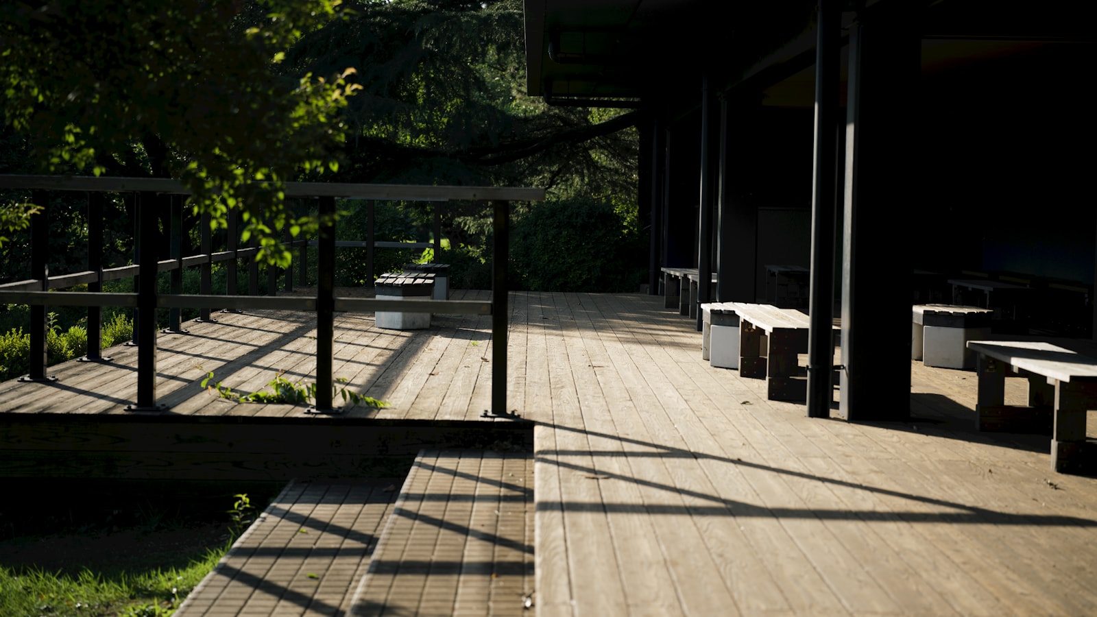 Finished wooden deck with steps and built-in seating