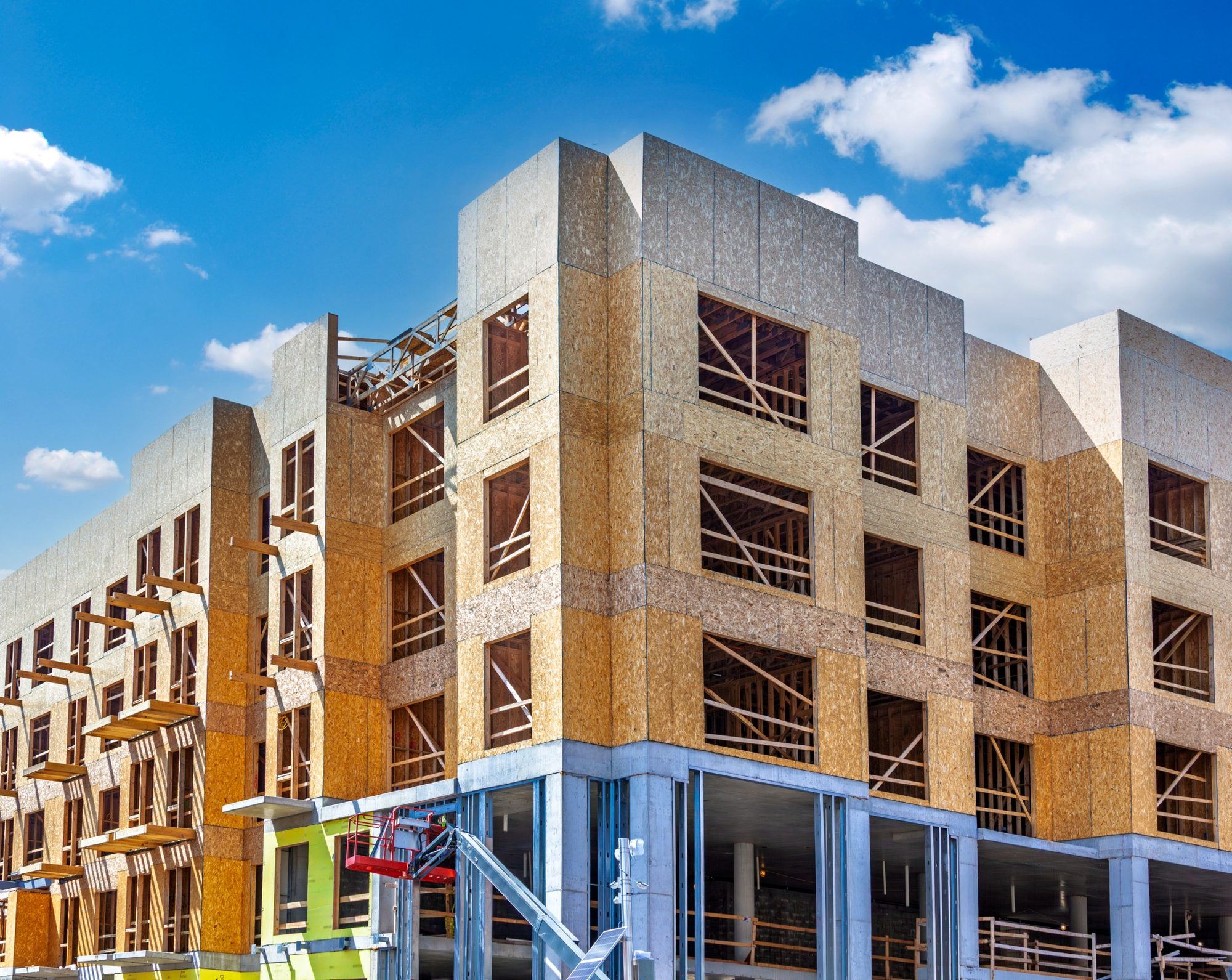 Interior commercial space under construction with exposed framing
