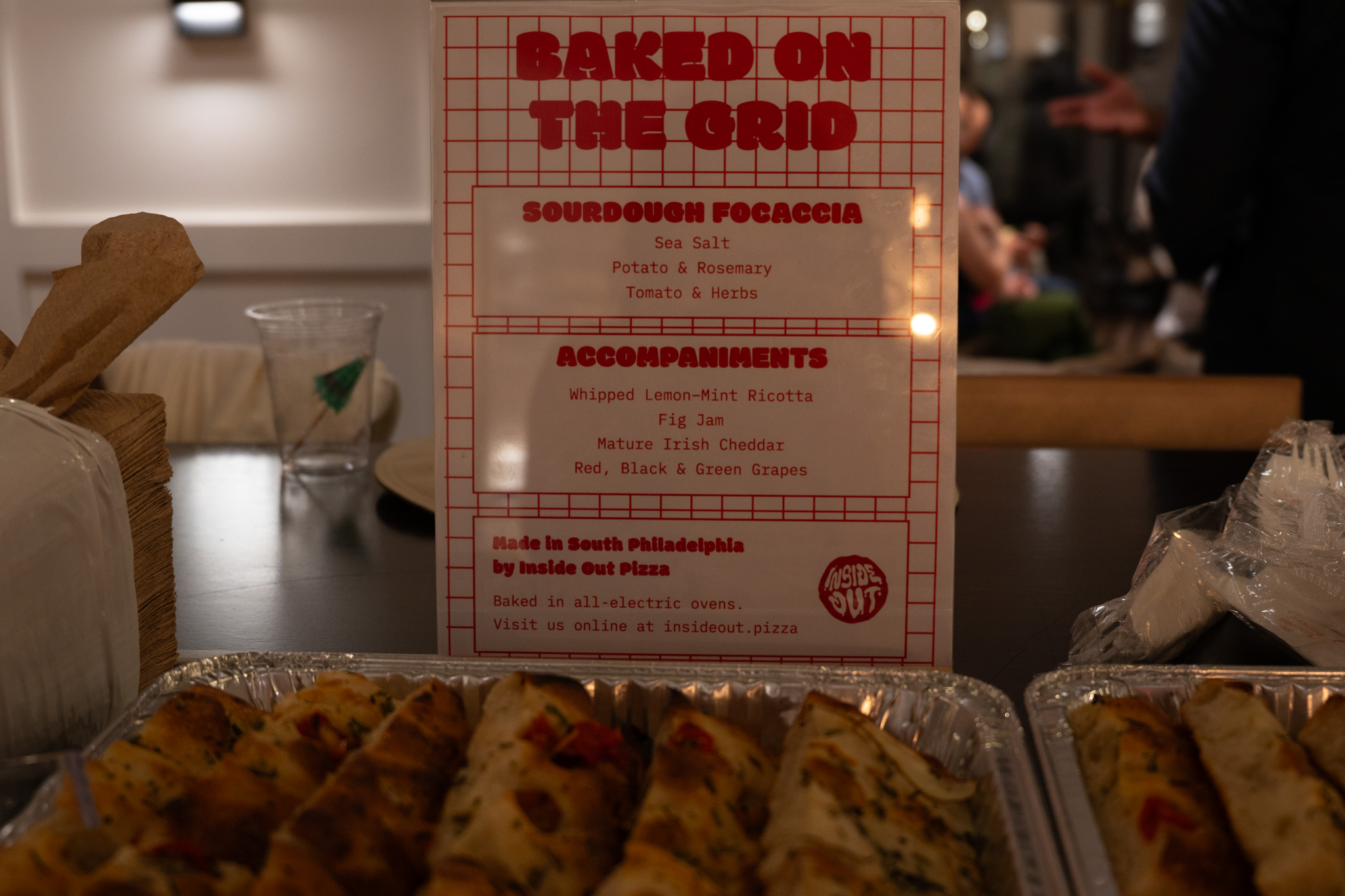The Baked on the Grid menu card at the food table