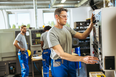 Staff working with CNC machinery