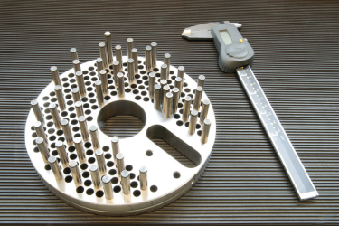 Machined parts and a caliper