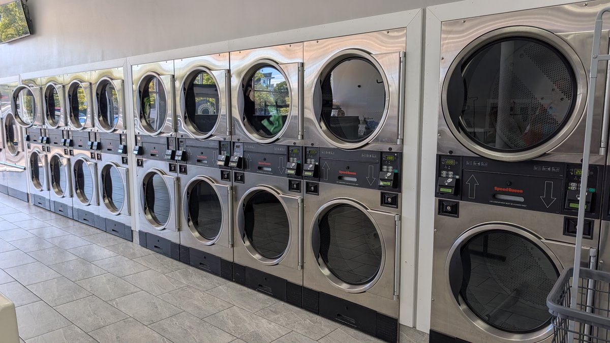 Long wall of stacked Speed Queen dryers at Lafayette Laundromat