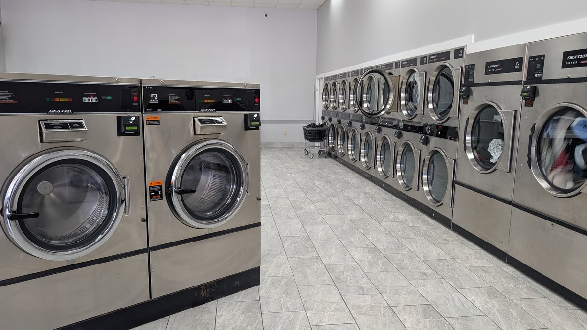 Oversized Dexter washers and a row of dryers at Lafayette Laundromat