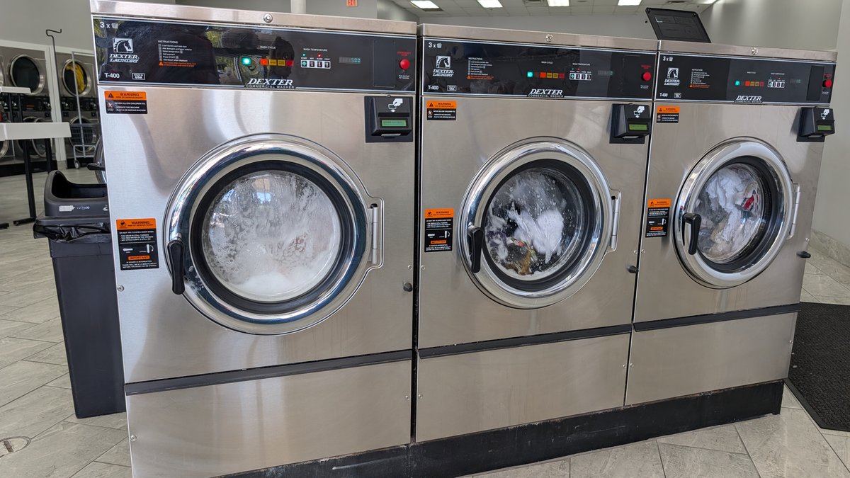 Dexter T-400 washers washing a load at Lafayette Laundromat in Detroit