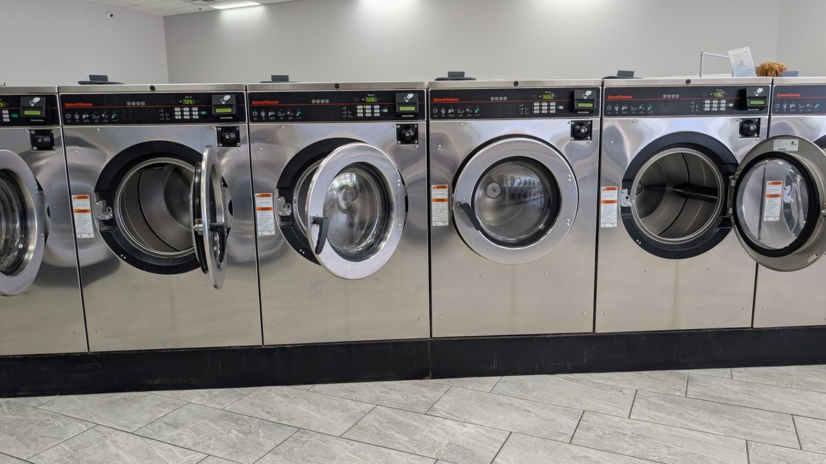 Front view of Speed Queen washers with their doors open