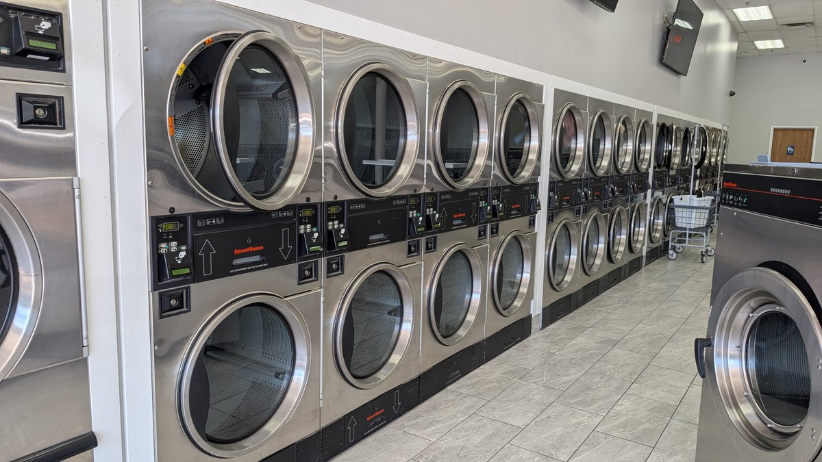 Large Dexter washers beside the Speed Queen washer row