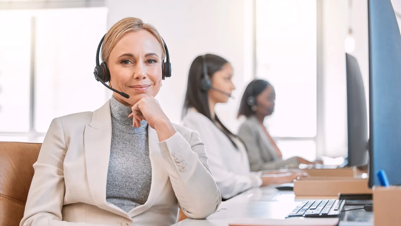 Support agent on a headset, working under a client brand