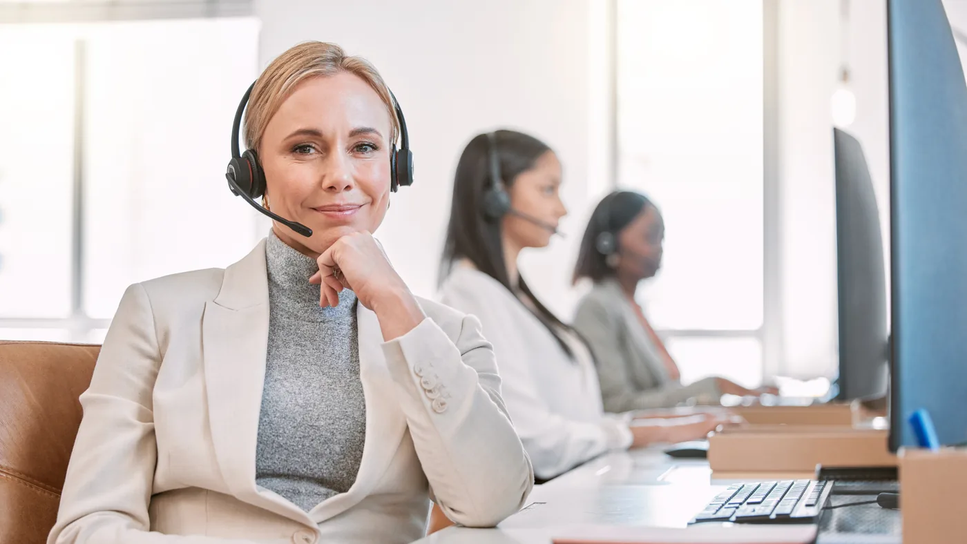 Support agent on a headset, working under a client brand