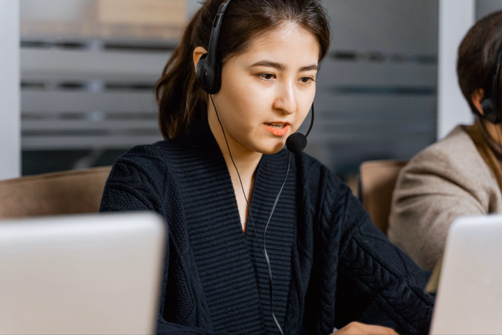 CallTek engineer on a headset, the escalation point behind AI for IT support