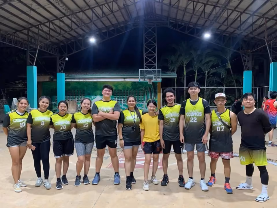 The Yellow Cosmos team in jerseys on the basketball court