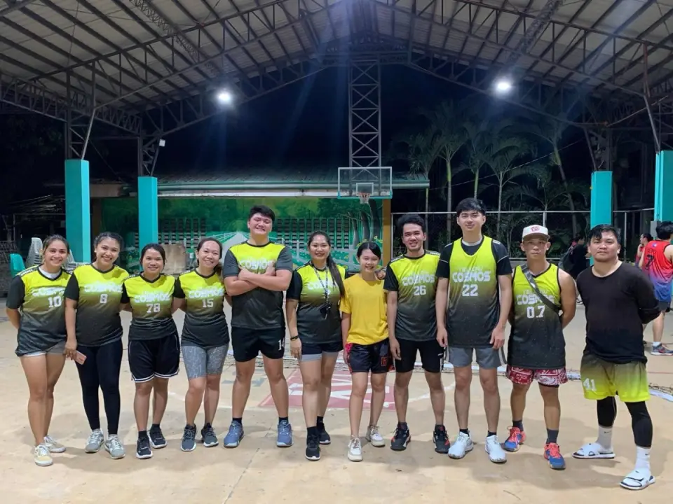 The Yellow Cosmos team in jerseys on the basketball court