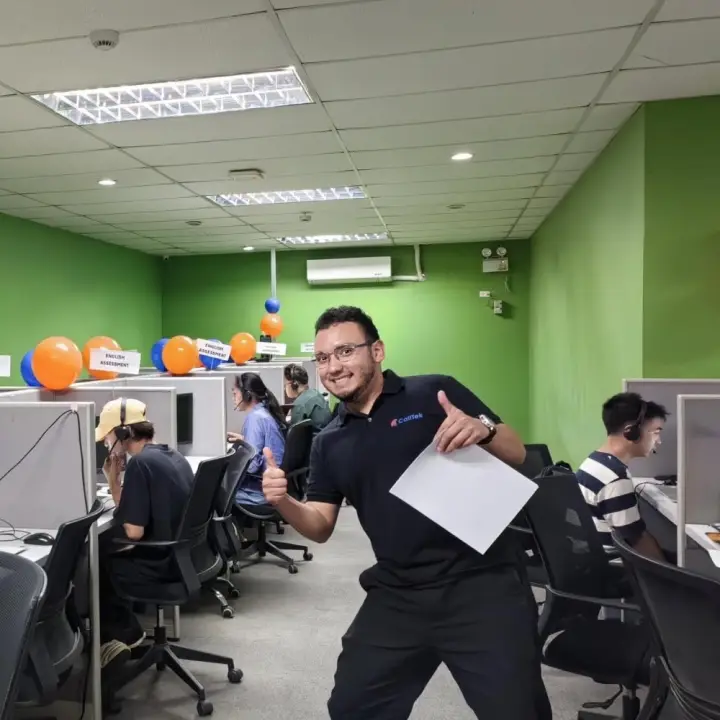 A CallTek team member giving a thumbs up on assessment day