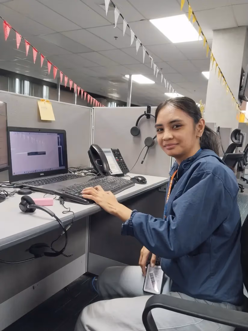 Maddy at her workstation in the CallTek office