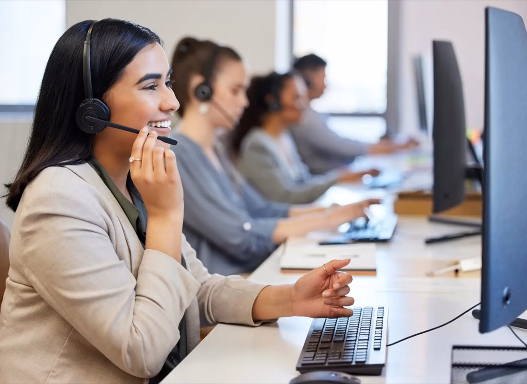 Customer support agents on headsets handling calls on the support floor