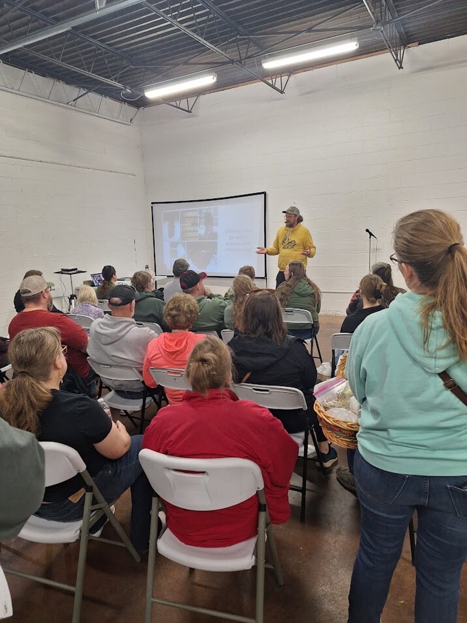Expo workshop with attendees learning about bees