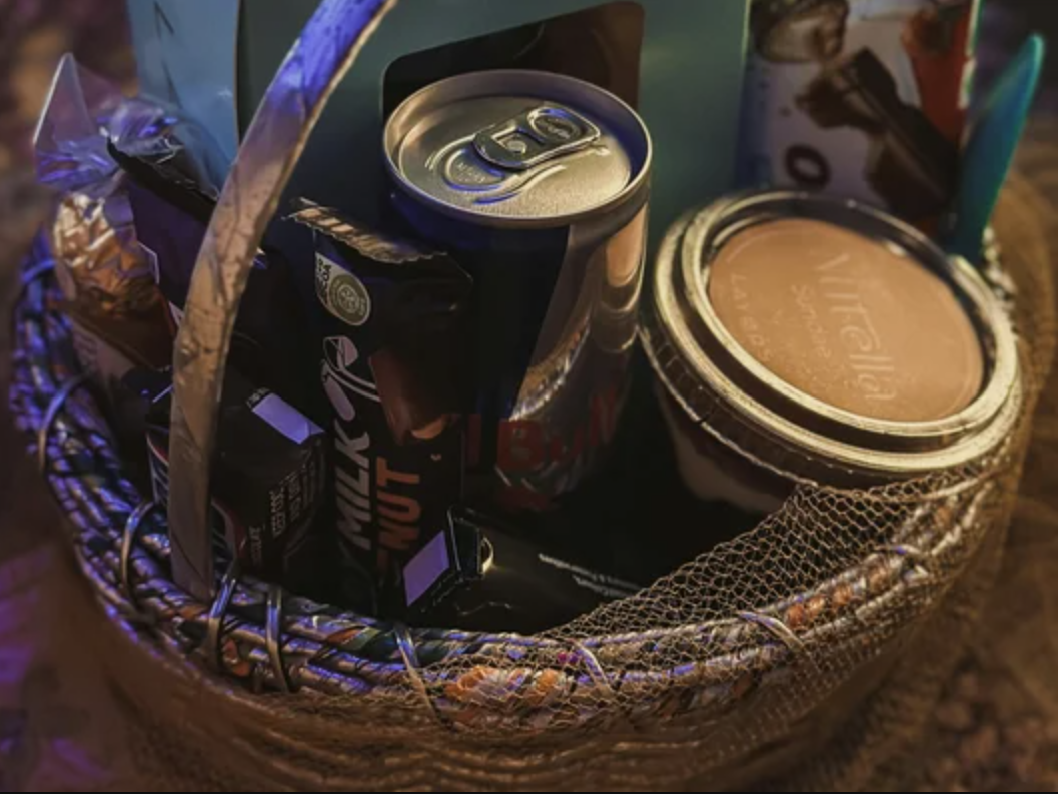 A woven raffle basket filled with prizes