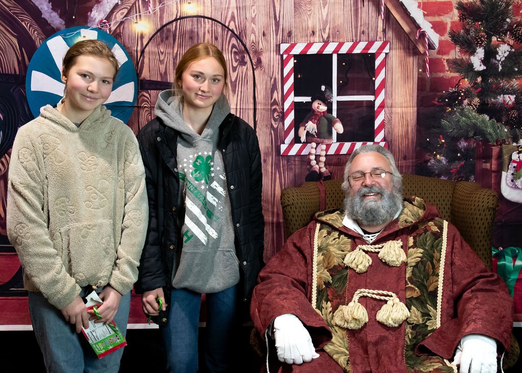 Two teens with Santa