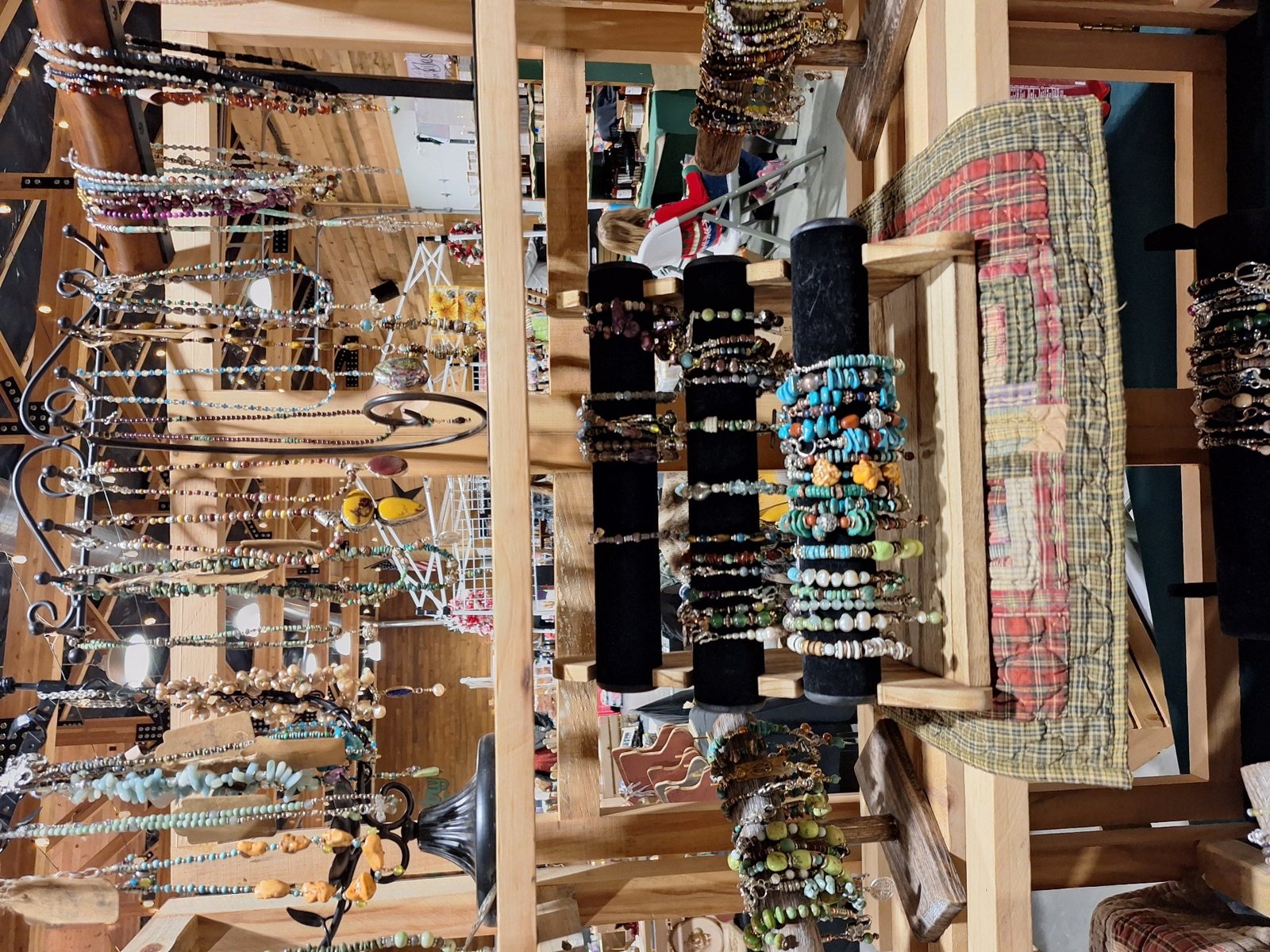 Handmade bracelets and necklaces at a vendor booth