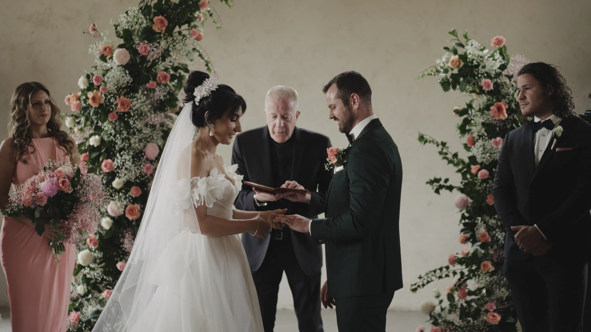 Couple exchanging rings during their wedding ceremony