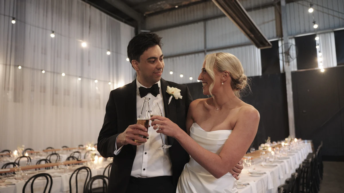 Couple toasting at their reception