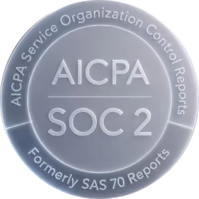 Silver circular badge with text reading 'AICPA Service Organization Control Reports' around the edge, 'AICPA' and 'SOC 2' in the center, and 'Formerly SAS 70 Reports' at the bottom.