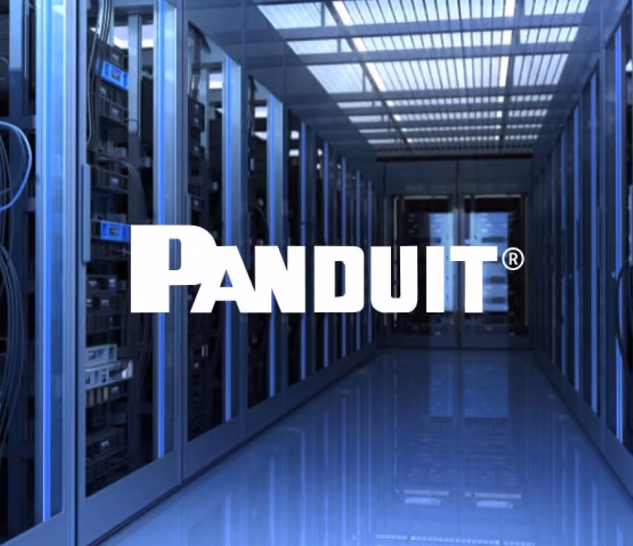 Row of server racks in a data center with a reflective floor and ceiling lights, overlaid with the text 'PANDUIT'.
