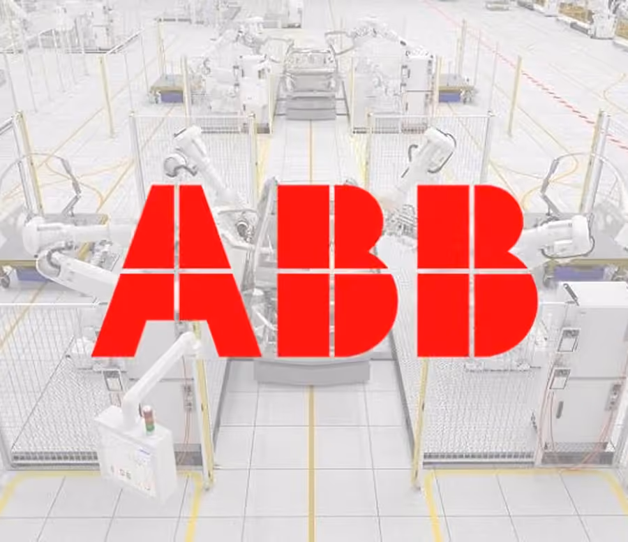 Red ABB logo superimposed over an industrial robotics facility with robotic arms arranged in fenced sections on a tiled factory floor.