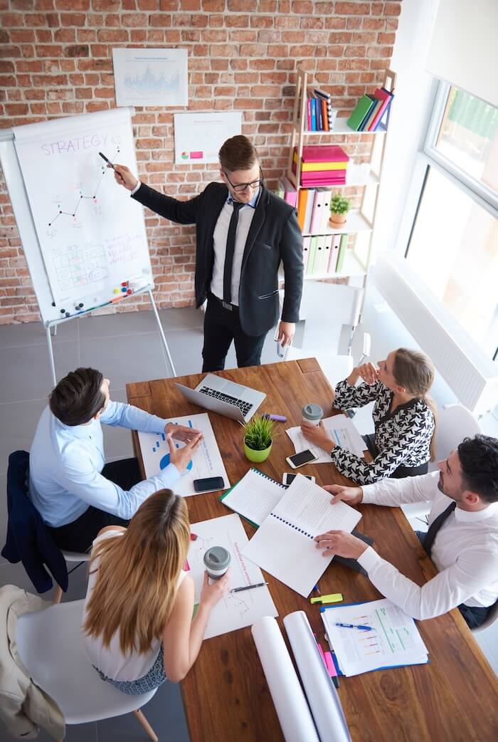 IT consultant presenting a technology strategy plan to his team