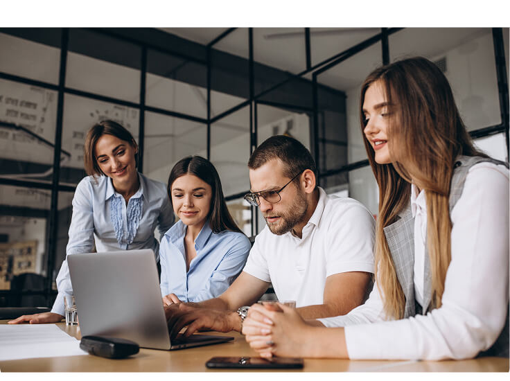 ITDATA's multidisciplinary team collaborating around a laptop