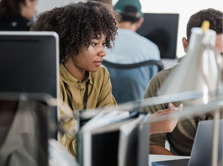 Support specialist handling service requests in an open office