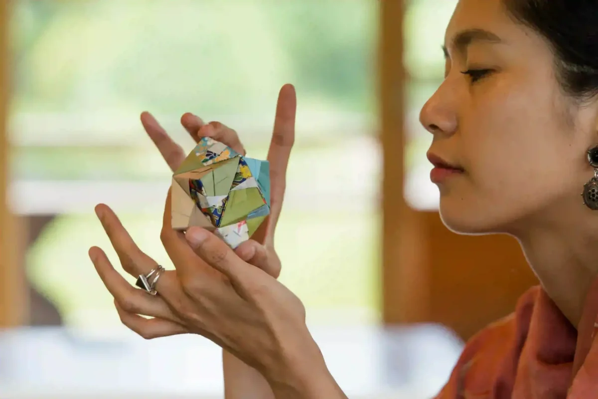 Woman holding origmai